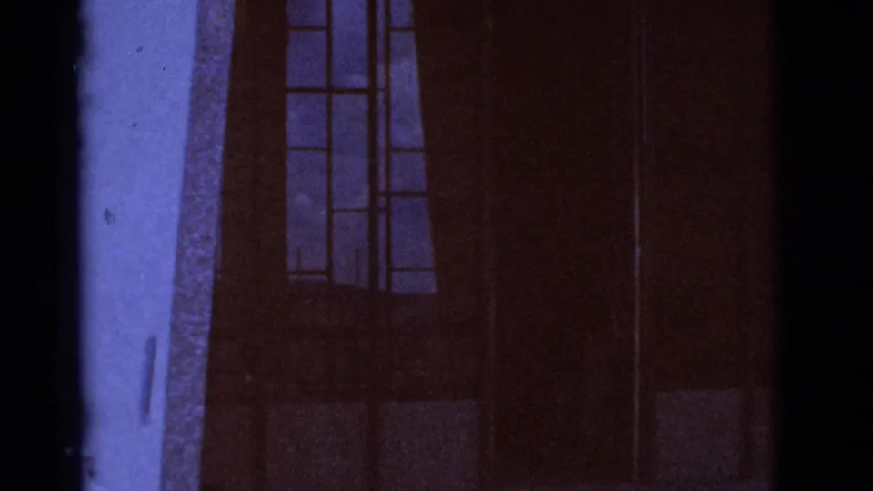 A darker 1966 Clarkdale frame shows window outlines beside a heavy vertical film-edge band and purple-brown color shift.