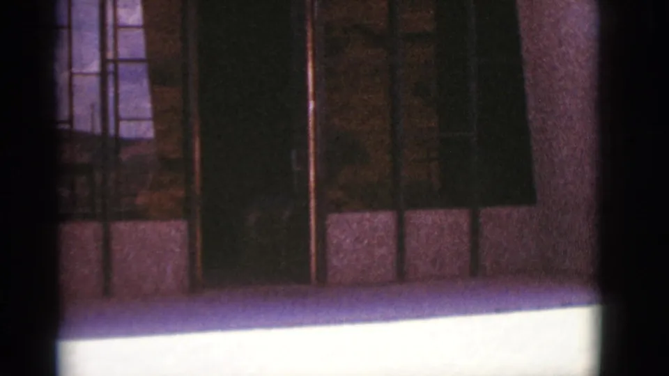 Final frame of the Clarkdale exterior pan, showing gridded windows, stone facade, and visible 8mm color shift.