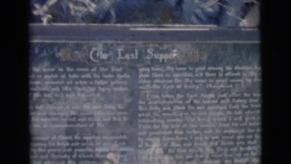 1966 Clarkdale, Arizona 8mm frame showing a soft close-up of a dark Last Supper marker with white lettering.