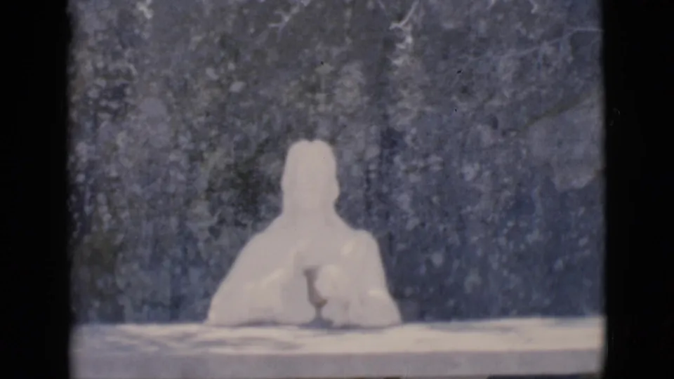 1966 Clarkdale, Arizona home-movie frame showing a white seated religious statue above handwritten Prayer for Peace text.