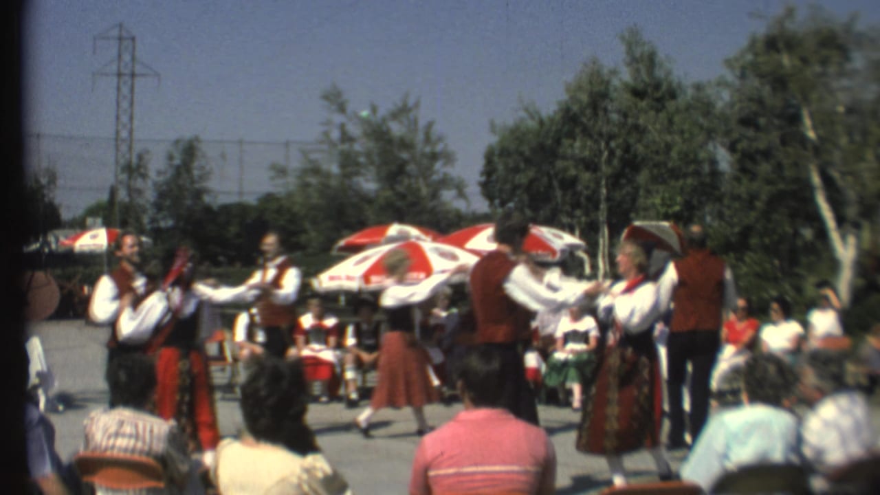 Norwegian folk dancers in red vests and patterned skirts perform outdoors at Grand Canyon in 1972.
