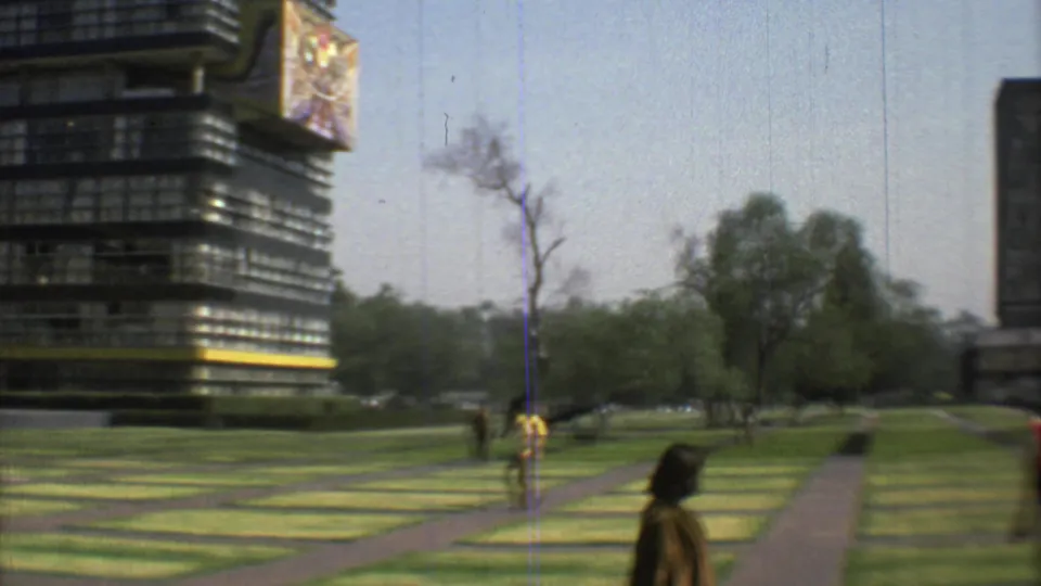 1973 Mexico City public green space with pedestrians, patterned lawns, paved walkways, trees, and modernist buildings in the background.