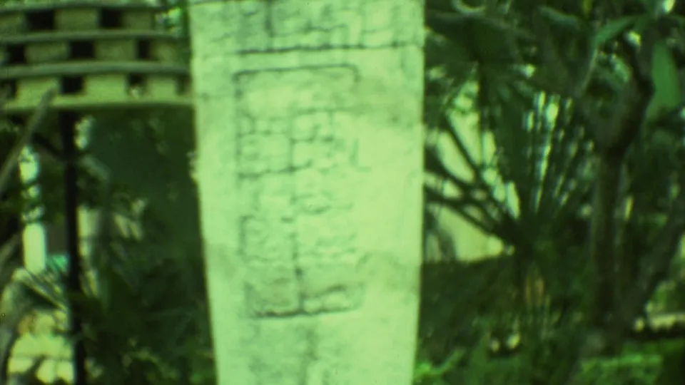 Soft 1973 8mm close-up of glyph-like carvings on a pale stone monument at an outdoor site in Yucatan.