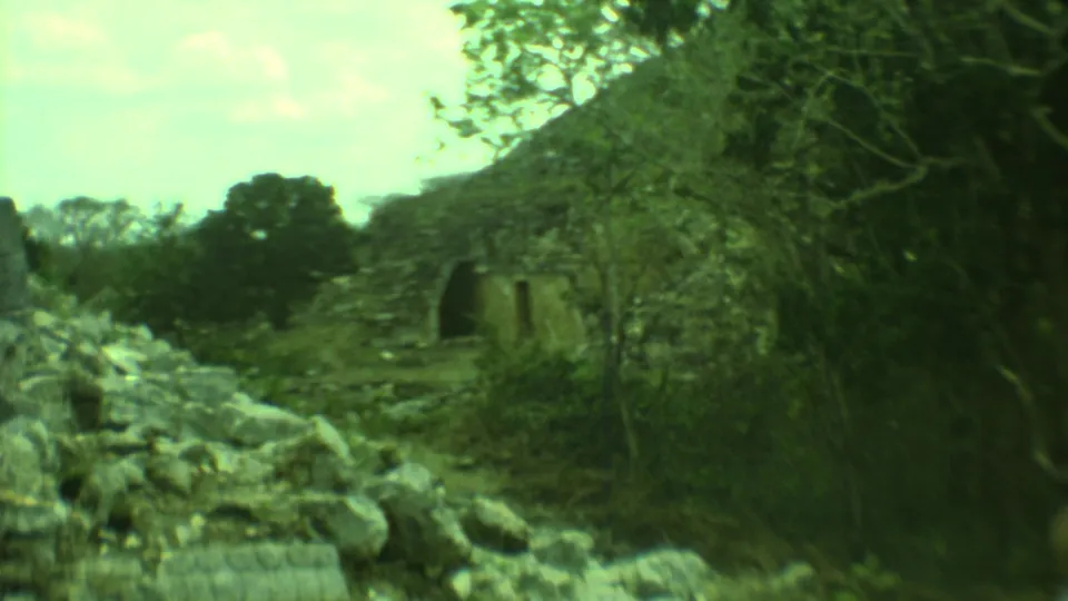 The final frame shows rubble, trees, and a weathered arched stone structure in 1973 Yucatan home-movie footage.