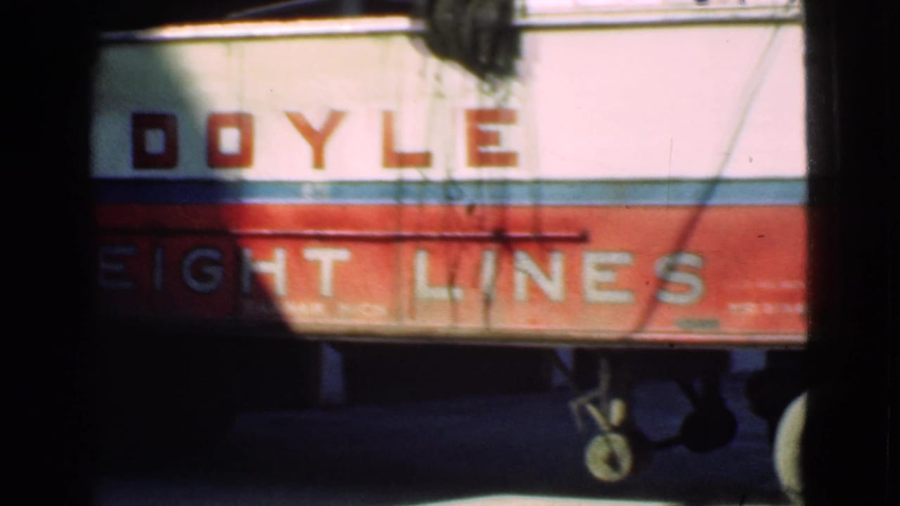 Close view of Doyle Freight Lines lettering on the truck side.