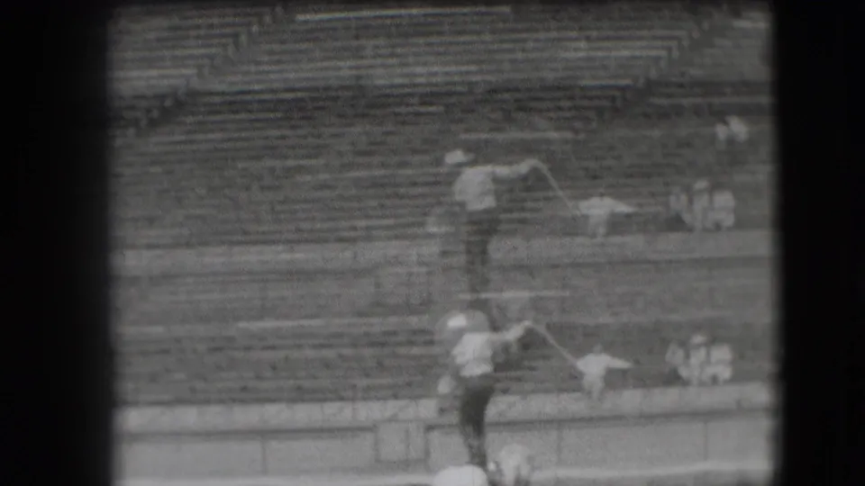 At the end of the Denver rodeo shot, the cowboy appears to swing a lasso while standing on the horse in the stadium arena.