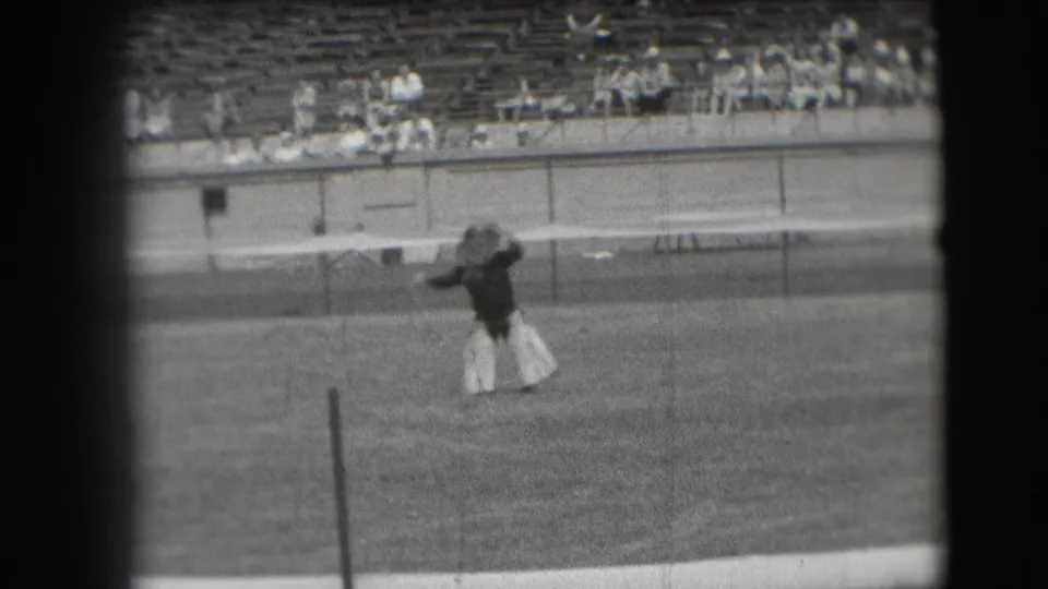 The 1941 Denver clip shows the cowboy-style dancer raising an arm during a field performance before distant stadium spectators.