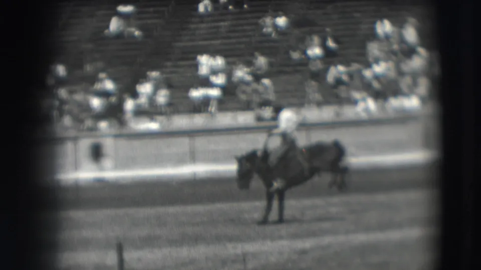 Near the end of the short Denver rodeo shot, the cowboy remains mounted as the horse steadies or slows in front of the bleachers.