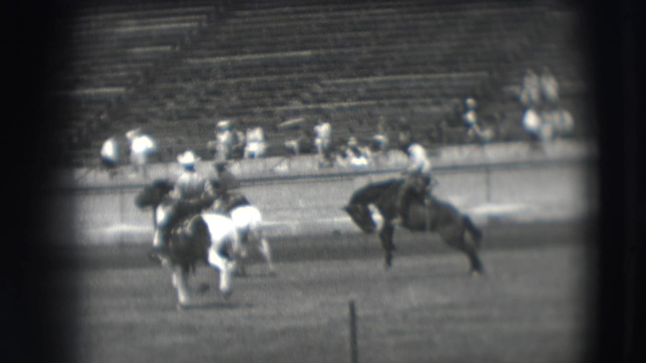 A group of horseback riders crosses the stadium field in the 1941 Denver competition, with spectators visible in tiered seats.