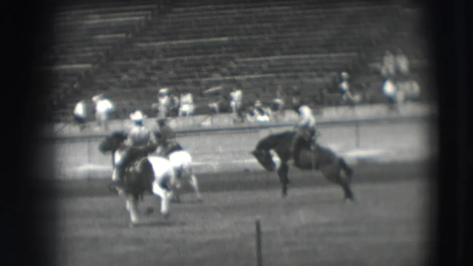 A group of horseback riders crosses the stadium field in the 1941 Denver competition, with spectators visible in tiered seats.