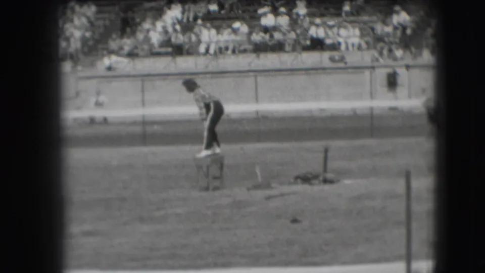 The distant 1941 Denver frame shows the same stool-side performer or participant against a racetrack wall and crowded bleachers.