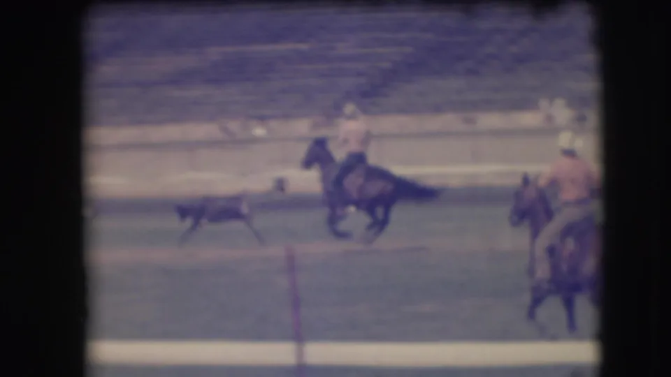 A color-tinted or faded frame shows the small animal running ahead of a mounted rider, with another rider partly visible at right.