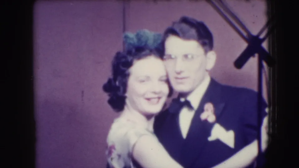 The final Joliet 1941 frame shows the couple smiling in a close dance pose, with 8mm grain and edge artifacts visible.