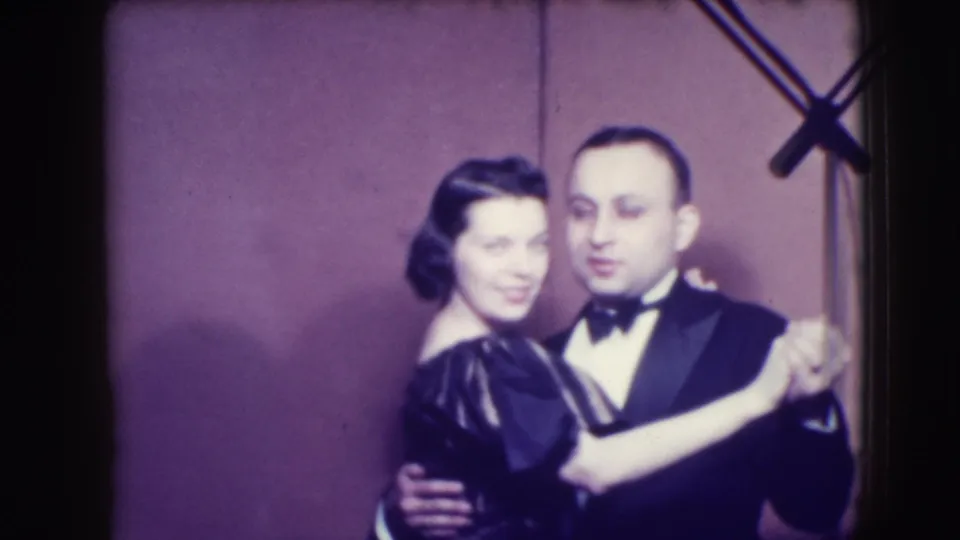 A soft-focus 8mm frame from Joliet, Illinois, 1941 shows the couple turning while holding a formal dance pose.