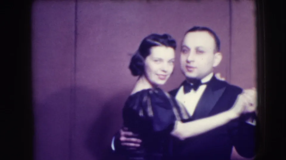 The final frame shows the 1941 Joliet couple facing the camera during a slow dance, with visible 8mm grain and color fade.