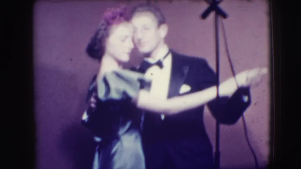 Soft 8mm frame from Joliet in 1941 showing the woman leaning into the man during a close formal dance pose.