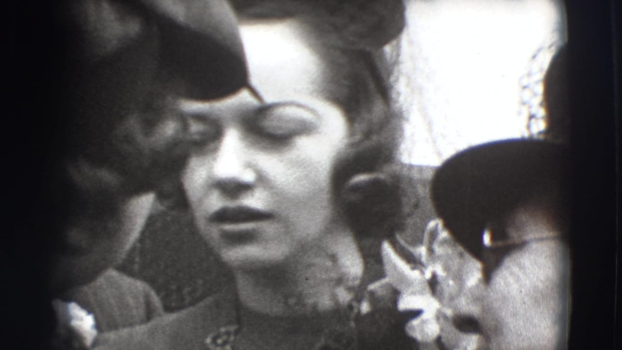 Close-up of a woman in a formal dress and hat among other adults.