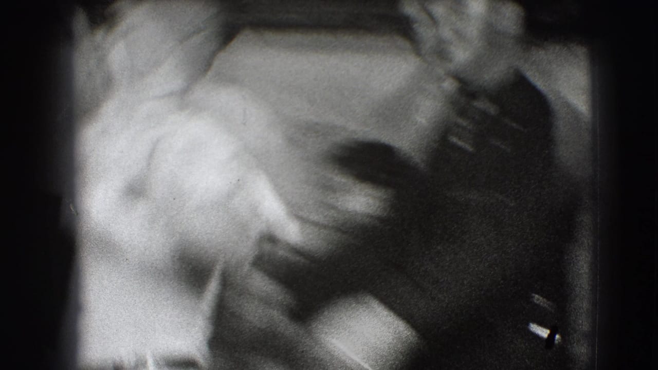 Blurred close view of two adults in a rehearsal setting.