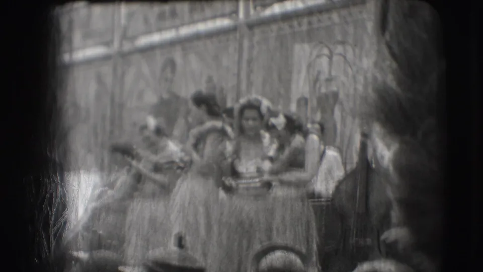 Costumed women in leis and raffia-style skirts gather on a Sarasota stage during the supplied 1948 Ringling Brothers performance clip.