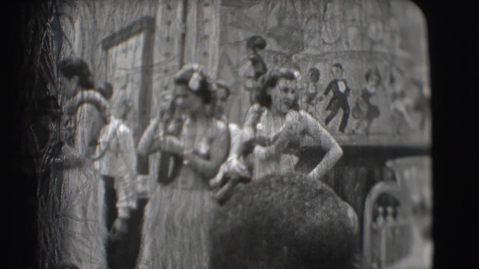 A hula-costumed performer stands near a cello player and other stage figures in this grainy 1948 Sarasota home-movie frame.
