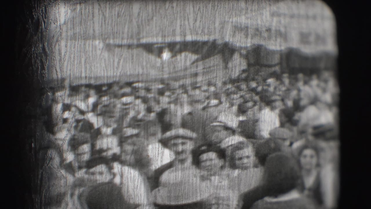 Adults in period clothing stand and move near a crowded entrance canopy.