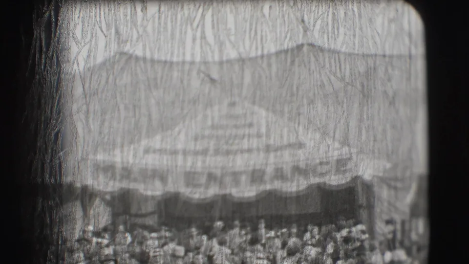 Crowd gathered beneath or near a broad tented entrance at the Ringling Brothers Sarasota setting.
