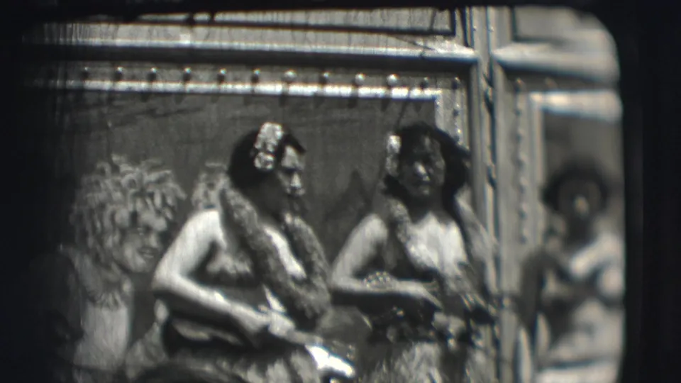 Costumed hula-style performers appear on a small stage or platform in the 1948 circus footage.