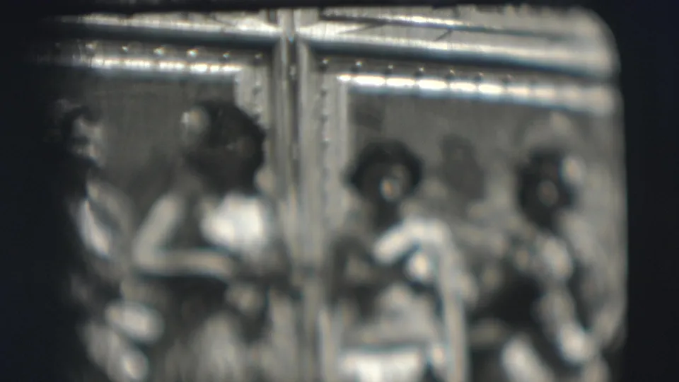 1948 Sarasota circus home-movie frame showing three women in costume standing together in soft focus.