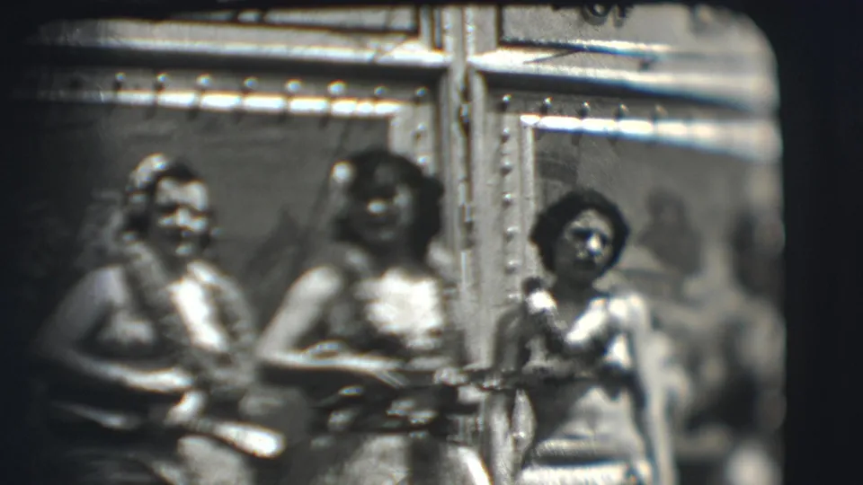 Three women wearing leis appear to perform with small string instruments inside a Ringling Brothers tent in Sarasota, Florida, in 1948.