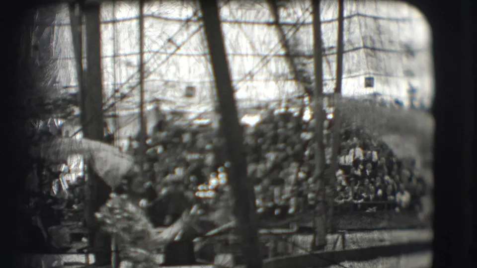 1948 circus parade footage in Sarasota with performers in decorative costumes seen through a distorted home-movie frame.