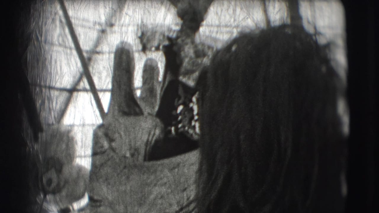 Costumed performer or animal figure near a spectator with hair visible at the right edge.