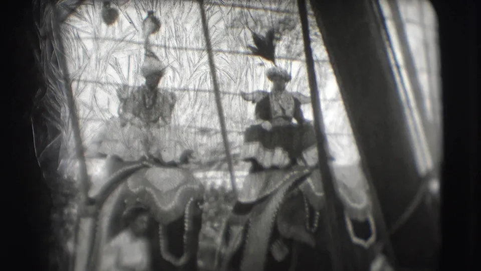 1948 Sarasota circus footage shows decorated elephants with costumed riders moving through the ring under the tent.