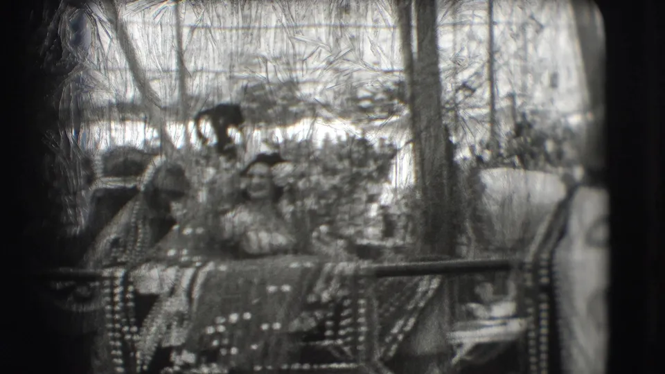 Costumed riders in ornate attire appear in the circus ring on decorated animal tack or a cart during the Ringling Brothers Sarasota home movie.