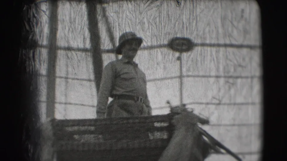 The 1948 Sarasota parade view shows a uniformed man on a float with part of an elephant visible below the railing.