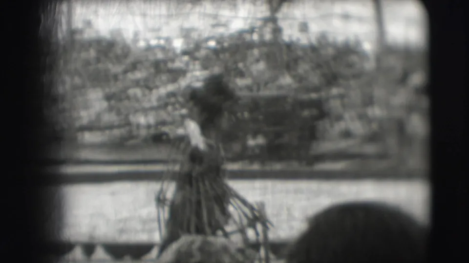 In 1948 Ringling Brothers Sarasota footage, a handler appears near a leashed bear inside a fenced performance area.