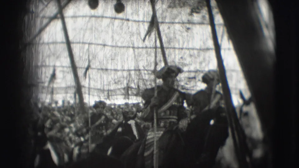 Grainy 1948 Sarasota parade footage shows two mounted uniformed riders with lances near the camera, with spectators filling the background.