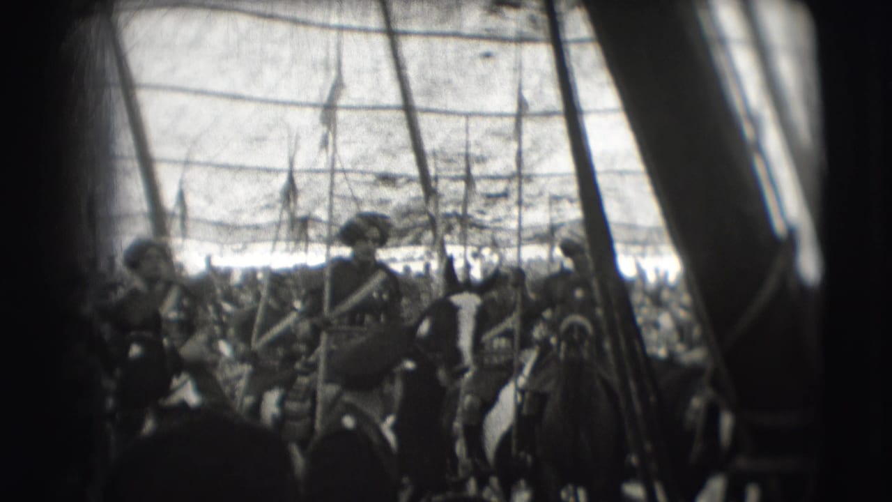 Armored riders on horseback carry lances inside a circus tent.