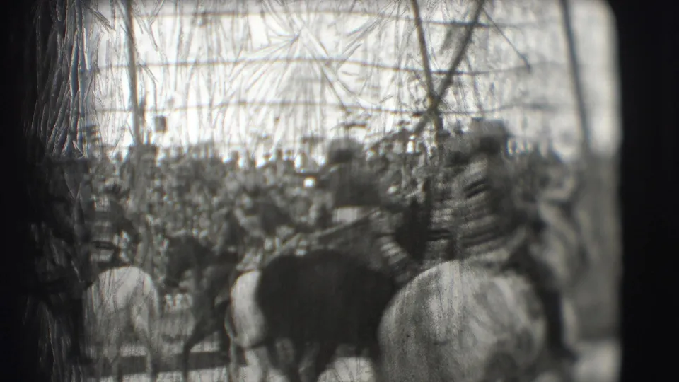 A horse and rider appear near the foreground as the Sarasota circus audience fills the background under the tent.