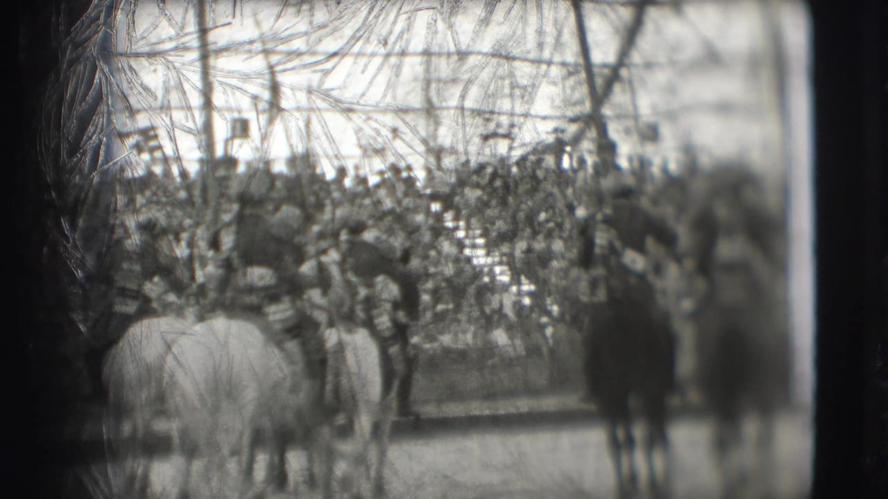 Crowded circus audience watches horses and riders in a ring from behind tent supports.