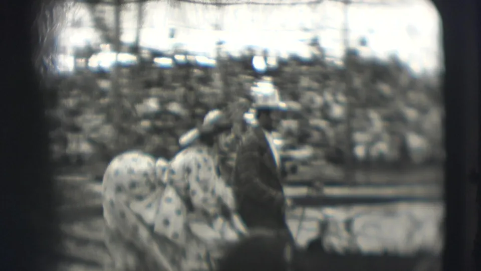 In 1948 Ringling Brothers Sarasota footage, a clown pushes a baby carriage in the ring while another performer stands nearby.