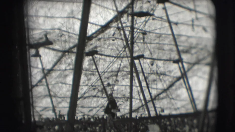Inside the 1948 circus tent, rigging lines and poles dominate the frame while the audience appears along the lower edge.
