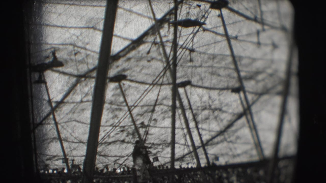 1948 Sarasota circus footage showing ropes, poles, and a performer silhouette inside the Ringling Brothers big top.