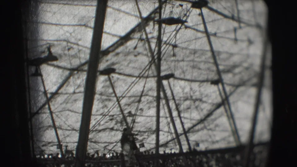 1948 Sarasota circus footage showing ropes, poles, and a performer silhouette inside the Ringling Brothers big top.