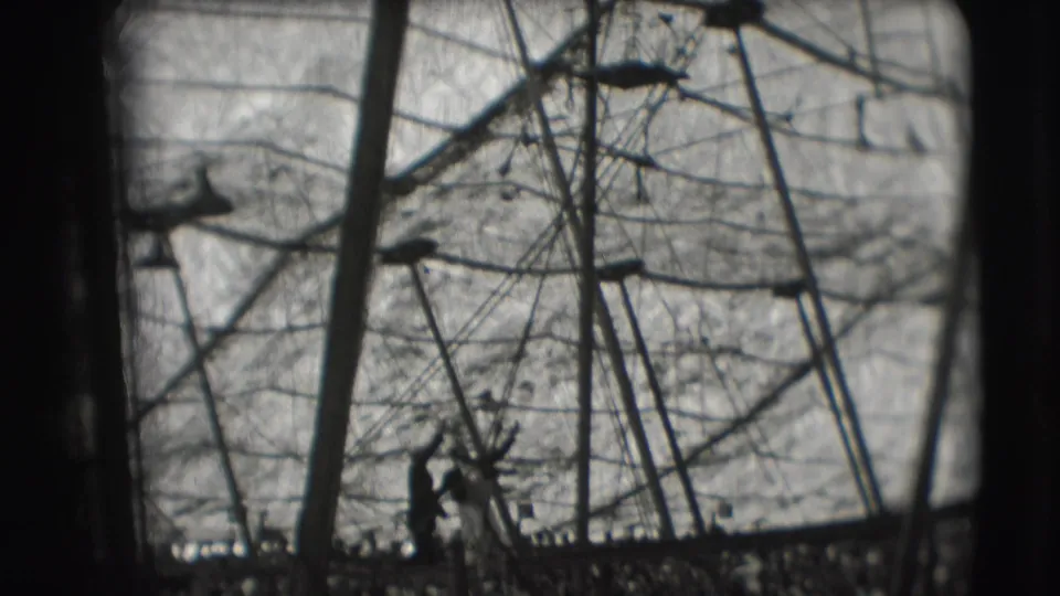 A silhouetted acrobat stands within the high rigging of a 1948 Sarasota Ringling Brothers tent scene.