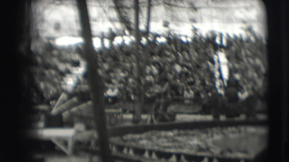 1948 Sarasota circus footage showing a packed audience under the big top with rigging and platforms in the foreground.