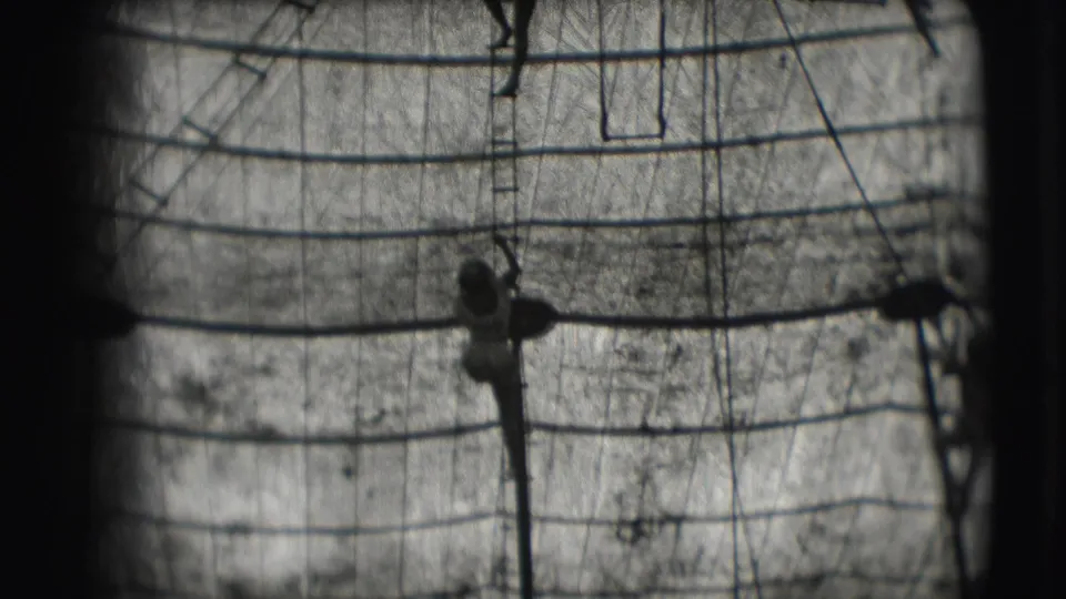 Black-and-white 1948 Ringling Brothers Sarasota footage shows a silhouetted trapeze performer against rigging and a lined backdrop.