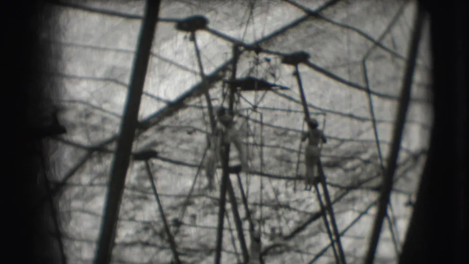 Distant women trapeze performers appear amid ropes, bars, and tent lines in the 1948 Ringling Brothers Sarasota setting.