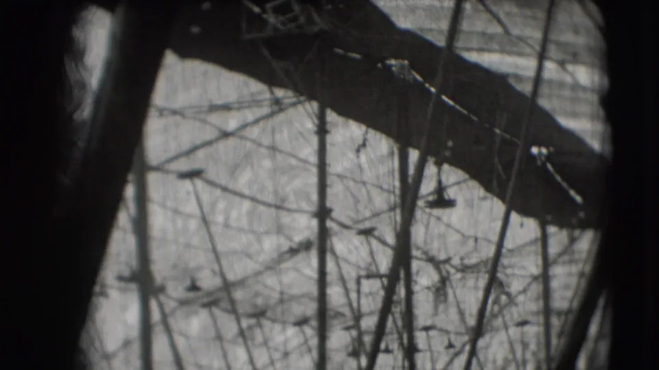 1948 Sarasota circus footage showing trapeze rigging, tent shadows, and a distant aerial performer seen from below.