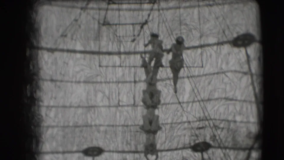 1948 Sarasota circus footage showing several trapeze artists on overhead bars and rigging inside the tent.
