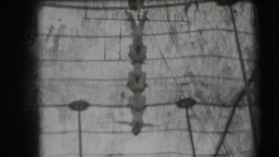 1948 Sarasota Ringling Brothers footage shows acrobats suspended in a vertical formation beneath a trapeze rig.